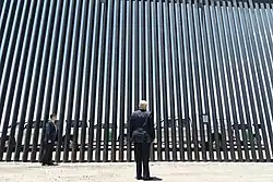 President Trump in front of "The Wall" at the Arizona–Mexico border (Craighead, 2020)