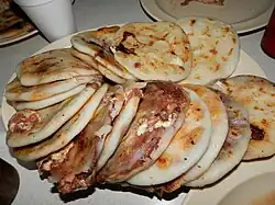 Several pupusas on a plate