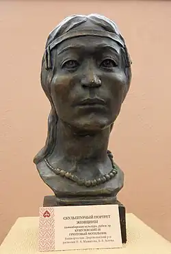 Bronze bust of a Pyany Bor woman wearing a headband and necklace