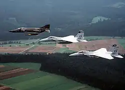 An RF-4E Phantom II of AG&nbsp;51 and two U.S. Air Force F-15A Eagles in flight over Germany