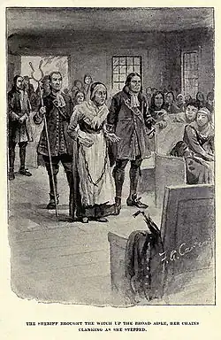 "The sheriff brought the witch up the broad aisle, her chains clanking as she stepped." Rebecca Nurse, as depicted by artist F.A. Carter in the historical novel, The Witch of Salem, or Credulity Run Mad, by John R. Musick. New York: Funk & Wagnalls Company, 1893. p.&nbsp;275.