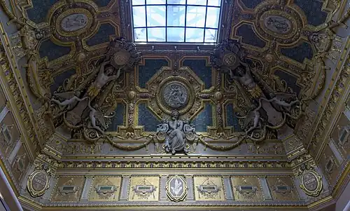 Neoclassical sculpted decoration on the ceiling of the Salon Carré, Louvre Palace, by Pierre-Charles Simart, 1851[53]