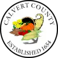A round seal featuring a cornucopia on a white background
