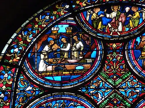 Medallion 12 (top left) : Thomas' body laid in a tomb