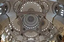 The Şehzade Mosque (1543–8) combines a central dome supported by four pillars and four semi-domes.[99]