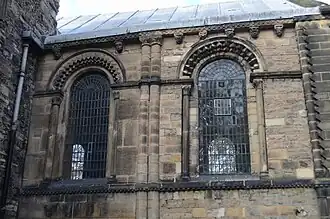 Norman chancel extern south facade (note grotesque corbels and arches)