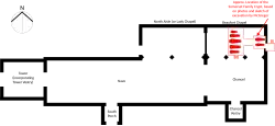 Floor plan outlining the building in black, with red showing the approximate location of the crypt.