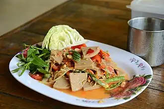 Green papaya salad with mu yo sausage (tam mu yo)
