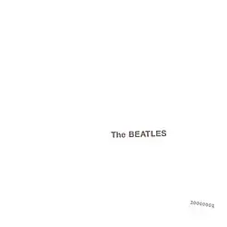 The words "The Beatles" embossed on a plain white background, with a serial number in the lower right.