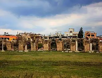 Remains of a Roman aquaeduct in Al-Buss with the camp in the background