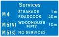 Availability of motorway service areas ahead with distances and names of operators