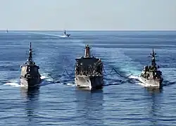 Tippecanoe refuels Japanese Maritime Self-Defense Force guided-missile destroyer JS&nbsp;Kongō and destroyer JS&nbsp;Ikazuchi&nbsp;(DD-107) on 5 December 2010.