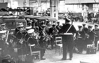 The Helsinki Police Band performing in a ceremony of Vanajan Autotehdas factory in 1957. The band is under the baton of Georg Malmstén.