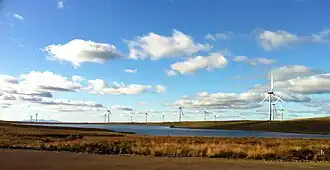 Whitelee Wind Farm with the Isle of Arran in the background
