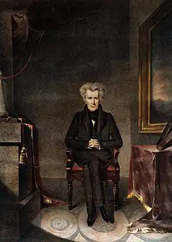 Oil painting of a white-haired Jackson, seated in a room with dark Victorian furnishings