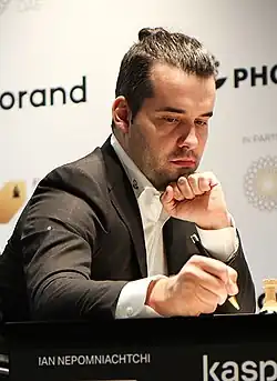 Nepomniachtchi writing on the scoresheet.
