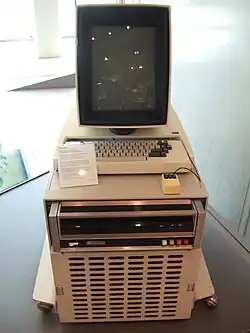 Computer with keyboard and monitor on top